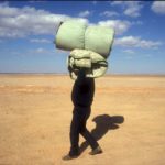 1991: Jordan/Iraq border. Refugees arriving in Jordan after Saddam Hussein's invasion of Kuwait. 1991: Jordan/Iraq border. Refugees arriving in Jordan after Saddam Hussein's invasion of Kuwait.